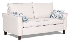Caprice Sofa featuring Zepel Tonga Range in light cream and additional blue contrast piping