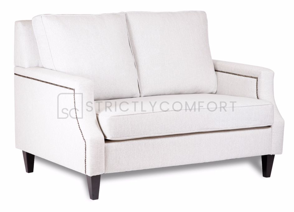 Hampton 2 Seater Sofa featuring Warwick fabric with bronze studs