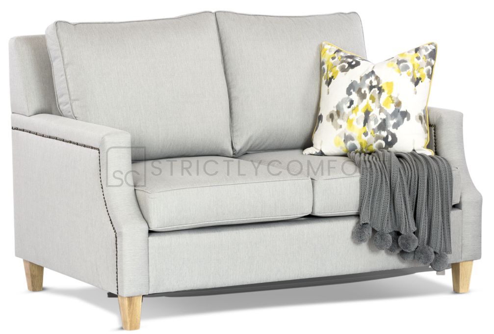 Hampton 2 seater single sofa bed featuring Warwick Vegas Steel fabric with Antique bronze studding