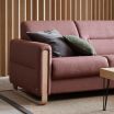 Stressless Fiona Sofa in Clover Dark Burgundy Fabric featuring Oak Wood Finish on the Arms